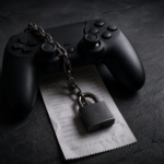 A game controller resting on a receipt with a small padlock and chain across them